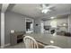 Open-concept kitchen with bar seating, white cabinets, and stainless steel appliances at 408 Ottawa Dr, Indianapolis, IN 46217