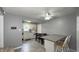 Eat-in kitchen with white cabinets and adjacent dining area at 408 Ottawa Dr, Indianapolis, IN 46217