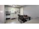 Well-lit kitchen features updated appliances, stylish backsplash, and a dining table at 408 Ottawa Dr, Indianapolis, IN 46217