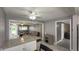 Open concept living area with tile flooring, stylish furnishings, and an eat-in kitchen at 408 Ottawa Dr, Indianapolis, IN 46217
