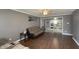 Open living room view with hardwood floors leading to a kitchen with bar seating at 408 Ottawa Dr, Indianapolis, IN 46217