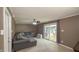 Cozy living room features a comfortable gray sofa and sliding glass doors leading to an outdoor patio area at 408 Ottawa Dr, Indianapolis, IN 46217