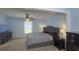 Comfortable bedroom features ceiling fan, carpet, and large windows at 408 Ottawa Dr, Indianapolis, IN 46217