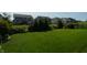 Lush green backyard with mature trees and plenty of space for outdoor activities at 4281 Viewforth Ln, Bargersville, IN 46106