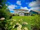 Spacious backyard featuring a well-maintained lawn, beautiful landscaping, and mature trees for privacy at 4281 Viewforth Ln, Bargersville, IN 46106