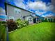 Expansive backyard with lush green lawn, mature trees, and a covered patio for outdoor entertaining at 4281 Viewforth Ln, Bargersville, IN 46106