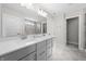 Modern bathroom showcasing a double vanity with quartz countertops and ample storage space at 4281 Viewforth Ln, Bargersville, IN 46106