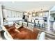 The dining room features a large table, a kitchen island with seating and modern stainless steel appliances at 4281 Viewforth Ln, Bargersville, IN 46106