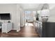 Bright, open entryway with hardwood floors, stylish console table, and seamless flow into the living spaces at 4281 Viewforth Ln, Bargersville, IN 46106