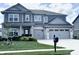 Charming two-story home featuring a brick and siding facade, well-manicured lawn, and an attached two-car garage at 4281 Viewforth Ln, Bargersville, IN 46106