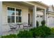 Inviting front porch with seating area, brick accents, and well-maintained landscaping, perfect for relaxing at 4281 Viewforth Ln, Bargersville, IN 46106