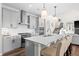Contemporary kitchen with white countertops, modern appliances, a large island, and bar stool seating at 4281 Viewforth Ln, Bargersville, IN 46106