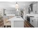 Modern kitchen with stainless steel appliances, a large center island, and stylish lighting fixtures at 4281 Viewforth Ln, Bargersville, IN 46106