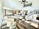 Bright, open concept living room featuring hardwood floors, fireplace, kitchen, and dining area at 4281 Viewforth Ln, Bargersville, IN 46106