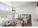Open-concept living room featuring a gray sectional, hardwood floors, and a kitchen island for seamless entertaining at 4281 Viewforth Ln, Bargersville, IN 46106