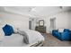Bright main bedroom featuring plush carpet, a blue chair and a dresser for storage at 4281 Viewforth Ln, Bargersville, IN 46106