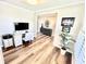 Home office with hardwood floors, desk, and a view into the hallway at 4281 Viewforth Ln, Bargersville, IN 46106