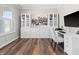 Bright home office featuring custom built-ins, a sleek white desk, and comfortable seating at 4281 Viewforth Ln, Bargersville, IN 46106
