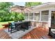 Backyard patio with outdoor seating beneath an umbrella, and a manicured lawn at 4585 Abbey Dr, Carmel, IN 46033
