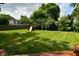 Backyard featuring a grassy area, mature trees, and a play set at 4585 Abbey Dr, Carmel, IN 46033