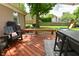 Spacious backyard featuring a deck, outdoor seating, grill, and a playset for the  at 4585 Abbey Dr, Carmel, IN 46033