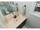 Bright bathroom featuring a stylish vanity, bronze fixtures, and a window with natural light at 4585 Abbey Dr, Carmel, IN 46033