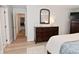Inviting bedroom featuring a wooden dresser and modern furniture, bathed in soft, natural light at 4585 Abbey Dr, Carmel, IN 46033