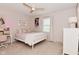 Comfortable bedroom showcasing a full bed, ceiling fan, and soft, neutral color scheme creating a relaxing space at 4585 Abbey Dr, Carmel, IN 46033