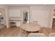 Open dining area with built-in desk space, perfect for meals and productivity at 4585 Abbey Dr, Carmel, IN 46033