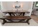 Dining area with farmhouse table, bench seating, carpet and wood floors at 4585 Abbey Dr, Carmel, IN 46033