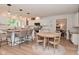 Kitchen boasts granite countertops, white cabinets, stainless steel appliances, a breakfast bar, and seating at 4585 Abbey Dr, Carmel, IN 46033