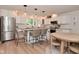 Modern kitchen featuring white cabinets, granite countertops, stainless appliances, and breakfast bar with seating at 4585 Abbey Dr, Carmel, IN 46033