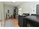 Functional laundry room equipped with modern washer and dryer, storage shelves, and wood-look flooring at 4585 Abbey Dr, Carmel, IN 46033