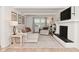 Bright living room features white painted fireplace, built-ins and comfortable seating at 4585 Abbey Dr, Carmel, IN 46033