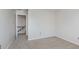 Bedroom with light walls and carpeting and open closet at 49 Druid Hill Ct # 0, Carmel, IN 46032