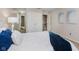 An airy bedroom featuring a closet, bright walls, and a peak at the stairs at 49 Druid Hill Ct # 0, Carmel, IN 46032