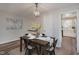 Dining room with natural light features neutral tones and convenient access to the kitchen at 49 Druid Hill Ct # 0, Carmel, IN 46032