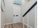 Clean entryway features light gray walls, a white front door, and wood-look flooring at 49 Druid Hill Ct # 0, Carmel, IN 46032