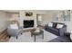 Cozy living room with a fireplace, stylish decor, and soft, neutral color palette at 49 Druid Hill Ct # 0, Carmel, IN 46032