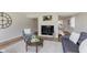 Comfortable living room features a decorative fireplace, modern decor, and neutral paint at 49 Druid Hill Ct # 0, Carmel, IN 46032
