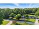 Aerial perspective of a home nestled amidst lush greenery in a peaceful residential area at 5170 Mt Pleasant N St, Greenwood, IN 46142