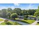 Aerial shot showcases the home's setting among mature trees and manicured lawns in a tranquil neighborhood at 5170 Mt Pleasant N St, Greenwood, IN 46142