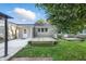 Spacious backyard with a wooden deck, concrete patio, and partially fenced yard at 5170 Mt Pleasant N St, Greenwood, IN 46142