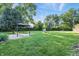 Expansive backyard with a gazebo and lush greenery, perfect for outdoor relaxation and entertainment at 5170 Mt Pleasant N St, Greenwood, IN 46142