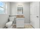 Well-lit bathroom featuring toilet, vanity with granite countertop, updated fixtures, and tiled floor at 5170 Mt Pleasant N St, Greenwood, IN 46142