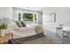 Brightly lit bedroom with a chair next to the window at 5170 Mt Pleasant N St, Greenwood, IN 46142