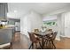 A dining area with modern table and chairs adjacent to the kitchen, showcasing the open floor plan at 5170 Mt Pleasant N St, Greenwood, IN 46142