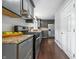An eat-in kitchen with stainless steel appliances, granite counters and grey cabinets at 5170 Mt Pleasant N St, Greenwood, IN 46142