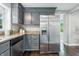 Kitchen featuring stainless steel refrigerator and grey cabinets at 5170 Mt Pleasant N St, Greenwood, IN 46142