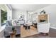 Bright living room with hardwood floors, stone fireplace, and modern furnishings at 5170 Mt Pleasant N St, Greenwood, IN 46142
